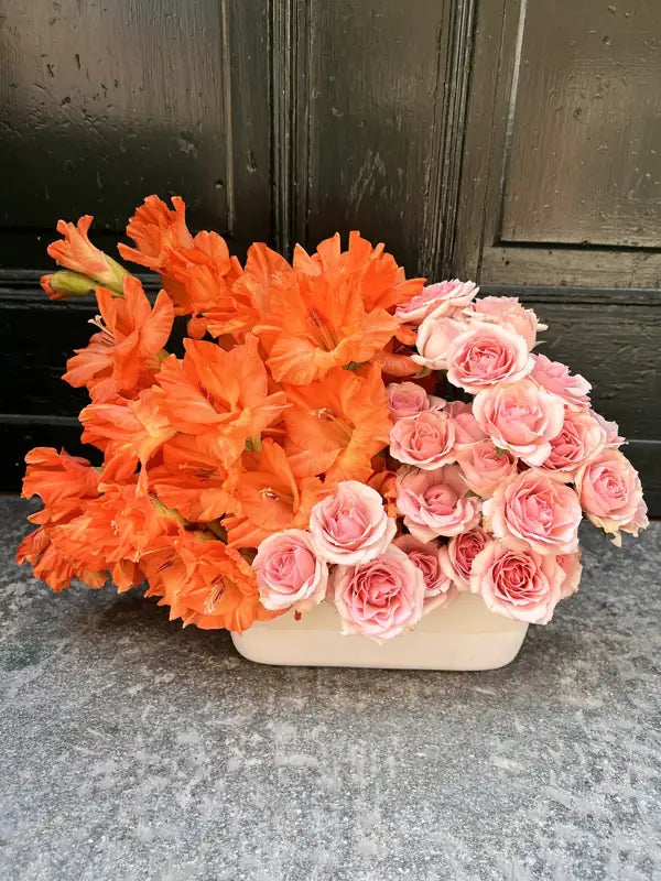 Orange gladiolus and pink spray rose statement arrangement